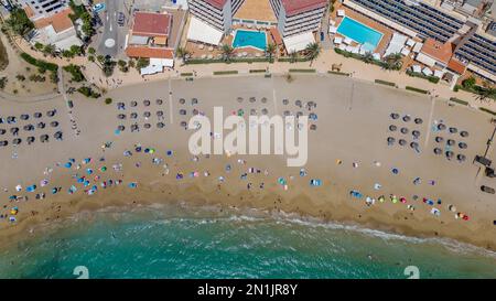 Picture dated July 14th shows the lucky holiday makers who have made it onto  the beach in Cala San Vicente,Ibiza,on Thursday morning.Many travellers Stock Photo