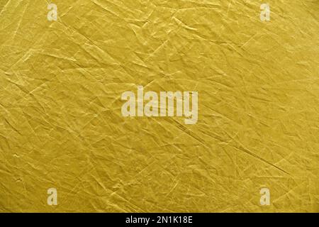 Abstract yellow gold background crumpled fabric Stock Photo