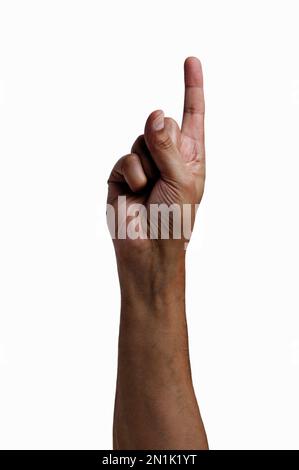 Close-up of man hand showing forefinger up with white background Stock Photo
