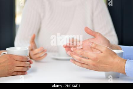 Three friends hands talking in a bar Stock Photo