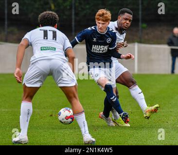 Swansea, Wales. 4 February 2023. Geoffroy Bony of Swansea City battles for  possession with Kyron Horsley-McKay of Millwall during the Professional  Development League game between Swansea City Under 18 and Millwall Under