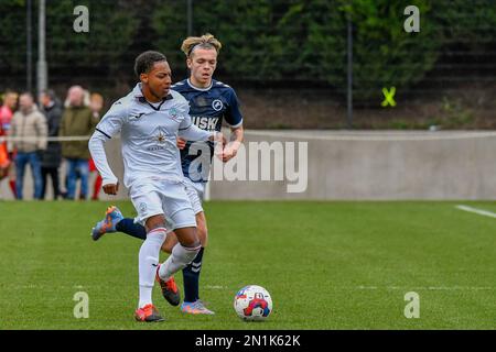 Swansea, Wales. 4 February 2023. Aimar Govea of Swansea City under pressure  from Finley Cotton of Millwall during the Professional Development League  game between Swansea City Under 18 and Millwall Under 18