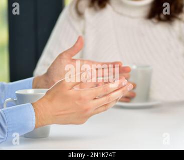 Two friends hands talking in a bar Stock Photo