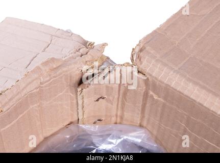 Battered cartboard box isolated on a white background Stock Photo