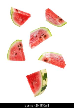 Fresh watermelon pieces falling on white background Stock Photo