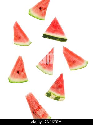 Fresh watermelon pieces falling on white background Stock Photo