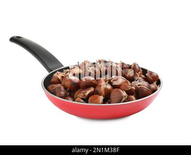 Roasted chestnut in frying pan on black stone background Stock Photo - Alamy