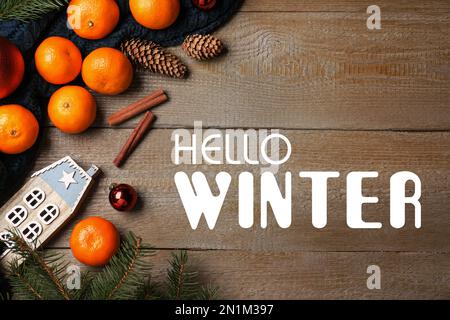 https://l450v.alamy.com/450v/2n1m397/hello-winter-greeting-card-flat-lay-composition-with-tangerines-on-wooden-background-2n1m397.jpg