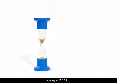 Hourglass isolated on white. Blue hourglass on white background with hard shadow. Medical hourglass. Hourglass Isolate Stock Photo