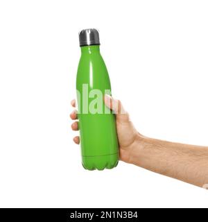 Man holding green thermos bottle on white background, closeup Stock Photo