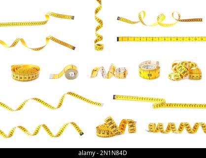Set of yellow measuring tapes on white background Stock Photo