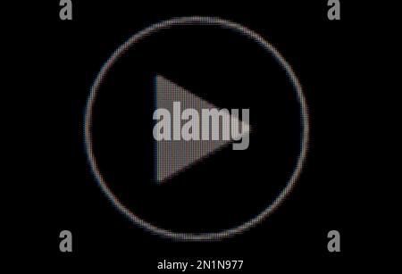 Macro play button with rgb lights on the TV on black background Stock Photo