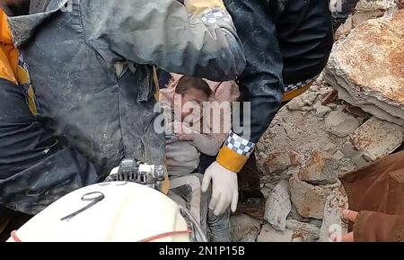 Idlib, Syria. 06th Feb, 2023. Rescue men evacuate a child pulled out of the rubble following an earthquake in northwestern Syrian Idlib in the rebel-held part of Idlib province, on February 6, 2023. - Hundreds have been reportedly killed in Turkey and Syria after a 7.8-magnitude earthquake that originated in Turkey and was felt across Middle East countries. Photo by Syria Civil Defense/UPI Credit: UPI/Alamy Live News Stock Photo