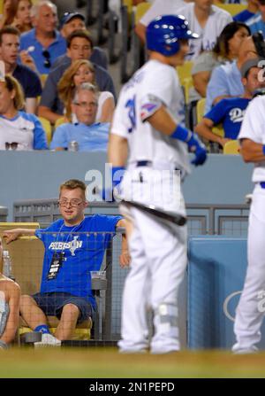 Champ Pederson, left, brother of Los Angeles Dodgers center fielder Joc  Pederson, right, celebrate after Champ threw out the ceremonial first pitch  prior to a baseball game against the St. Louis Cardinals