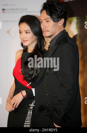 Taiwanese actress Shu Qi, left, and actor Chang Chen pose at the opening of the Cine Fan Summer Film Festival and the premiere of their movie 'The Assassin' in Hong Kong, Tuesday, Aug. 11, 2015. (AP Photo/Vincent Yu)