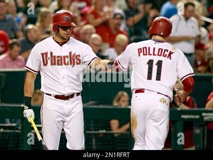 Arizona Diamondbacks' David Peralta smiles from behind the batting cage  during warm ups before of a baseball game against the San Diego Padres in  San Diego, Saturday, May 20, 2017. (AP Photo/Alex