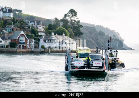 The Dart lower ferry at Dartmouth Devon Uk. The ferry has departed from Kingswear and crossed the river Dart to Dartmouth. Vehicles wait to disembark Stock Photo