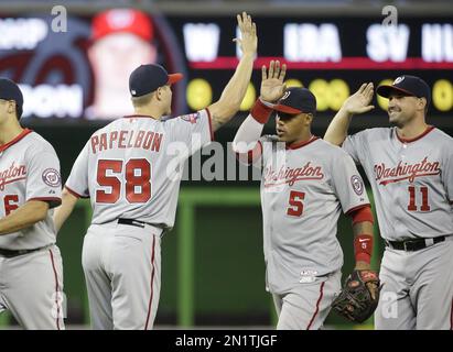 Washington Nationals closing pitcher Jonathan Papelbon (58) high-fives  right fielder Bryce Harper (34) after a baseball game against the Miami  Marlins, Thursday, July 30, 2015, in Miami. The Nationals defeated the  Marlins