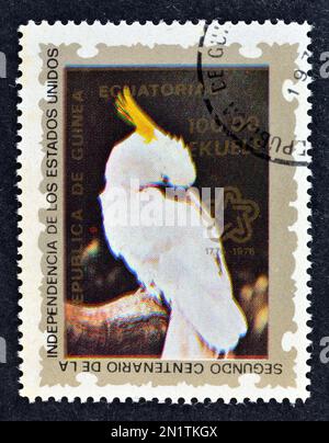 Cancelled postage stamp printed by Equatorial Guinea, that shows Sulphur-crested Cockatoo (Cacatua galerita), circa 1976. Stock Photo