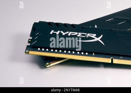 HyperX DDR4 RAM modules on a silver surface close-up. Parts for building and upgrading a PC Stock Photo