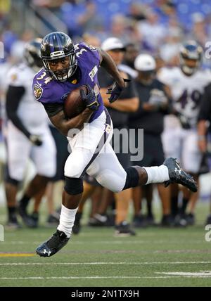 Baltimore Ravens running back Lorenzo Taliaferro (34) gains 11 yards in the  fourth quarter against the Pittsburgh Steelers at Heinz Field in Pittsburgh  on October 1, 2015. The Ravens went on to