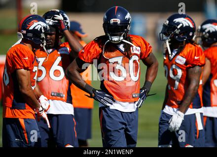 Denver Broncos strong safety David Bruton hits Green Bay Packers