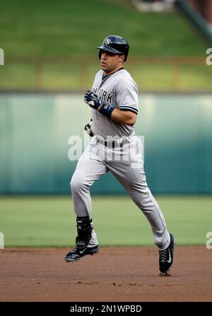 Texas Rangers Mark Teixeira runs out of the batters box after hitting a  double off of Cleveland Indians pitcher Cliff Lee that scored Alfonso  Soriano and Michael Young in the third inning