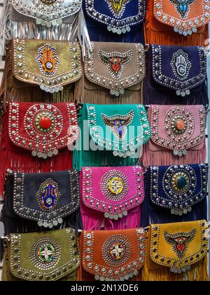 Colorful Moroccan artisan bags exposed in the street of a shop in Marrakech Morocco Stock Photo