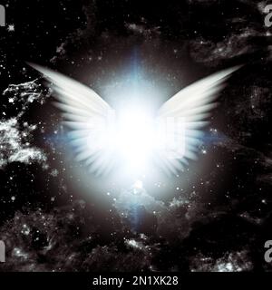 Shining angel wings in space Stock Photo