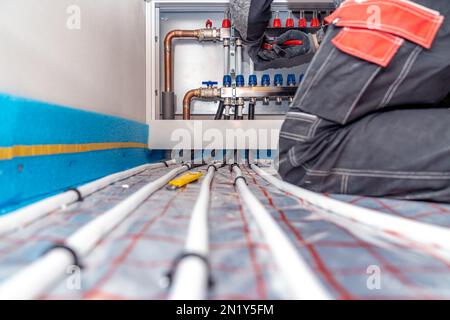connecting the floor heating to the switchboard Stock Photo