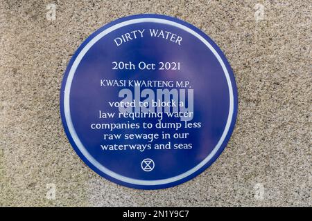Extinction Rebellion blue plaque on Staines Bridge over river Thames, Surrey, UK, Dirty Water 20th October 2021, protesting dumping of raw sewage Stock Photo