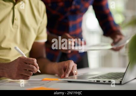 UI and UX designers working on new project together, selective focus Stock Photo