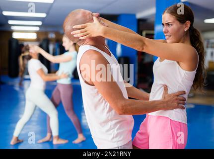 Woman training eye-gouging movement Stock Photo