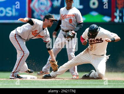 Minnesota Twins' Aaron Hicks, right, is safe stealing second base