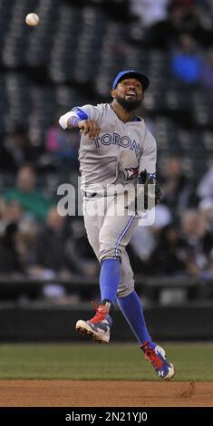 Toronto Blue Jays' Jose Reyes stands at second base after hitting a stand  up double as Texas Rangers' Elvis Andrus looks on and second base umpire  Chris Conroy calls for time during