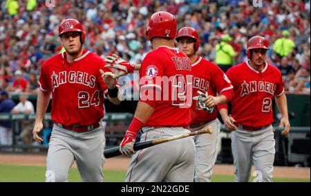 Texas Rangers designated hitter Brad Miller hits a line drive into a double  play against the Minnesota Twins during the ninth inning of a baseball  game, Friday, August 19, 2022, in Minneapolis.