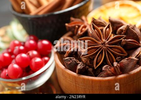 Dry anise stars in bowl, closeup. Mulled wine ingredient Stock Photo