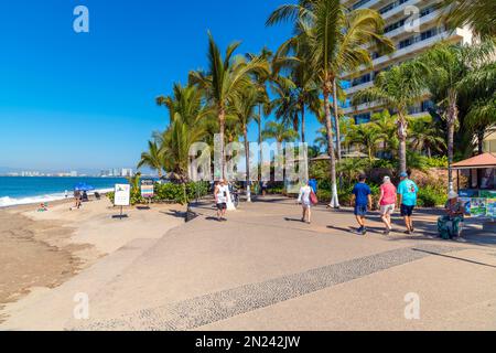 Shops, cafes, hotels and souvenir booths at the seaside promenade at Los Muertos Olas Altas beach in touristic Romantic Zone, Puerto Vallarta Mexico. Stock Photo