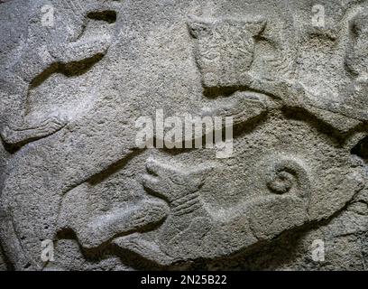 Relief with hunting subject. Close-up. fragment. A lion and a dog. Andesite, Alaca, Çorum. 1399 - 1300 B.C. 14th century BC Stock Photo