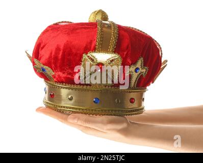 Woman holding beautiful velvet crown on white background, closeup. Fantasy item Stock Photo