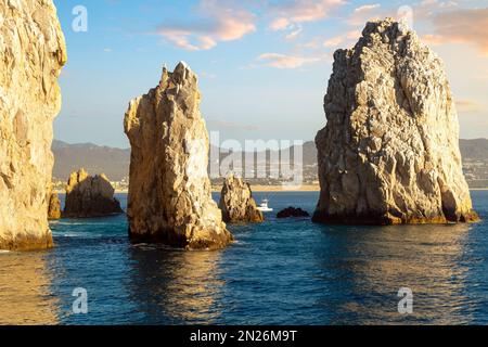 Late afternoon sun highlights the Friars rock formation at Land's End, on the Baja Peninsula at Cabo San Lucas, Mexico. Stock Photo