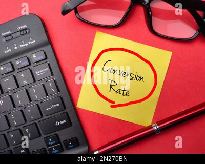 Keyboard and pencil with the word Conversion Rate. Business concept. Stock Photo