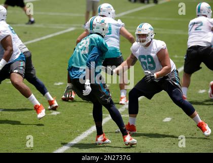 Miami Dolphins offensive lineman Michael Deiter (63) talks with Miami  Dolphins quarterback Teddy Bridgewater on the sidelines during an NFL  football game against the Houston Texans, Sunday, Nov. 27, 2022, in Miami