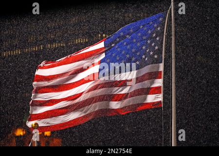 United States flags fly in center field before a baseball game