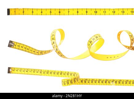 Set of yellow measuring tapes on white background Stock Photo