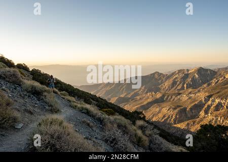Woman Turns Corner on Trail toward Telescope Peak in Death Valley National Park Stock Photo