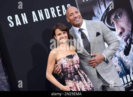 Carla Gugino, left, and Dwayne Johnson arrive at the premiere of 'San Andreas' at the TCL Chinese Theatre on Tuesday, May 26, 2015, in Los Angeles. (Photo by Richard Shotwell/Invision/AP)
