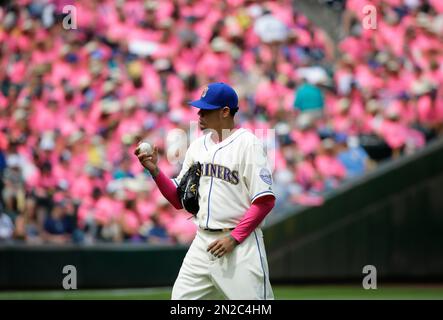 Fans in the Kings Court section cheer for Seattle Mariners starting  pitcher Felix Hernandez (34) after a strikeout in the fifth inning of a  baseball game against the Milwaukee Brewers, Sunday, Aug.