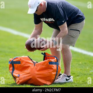 Minnesota Vikings assistant equipment manager Adam Groene carries helmets  before an NFL football game between the Vikings and Chicago Bears in  Chicago, Sunday, Nov. 14, 2010. (AP Photo/Charles Rex Arbogast Stock Photo 