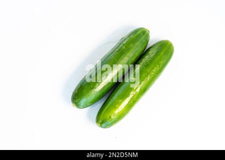 Two fresh cucumbers isolated on white background Stock Photo